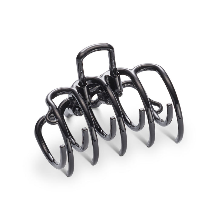 Seitliche Ansicht der Haarklammer – mit elastischen Zähnen und patentierten Bügeln für sicheren Halt