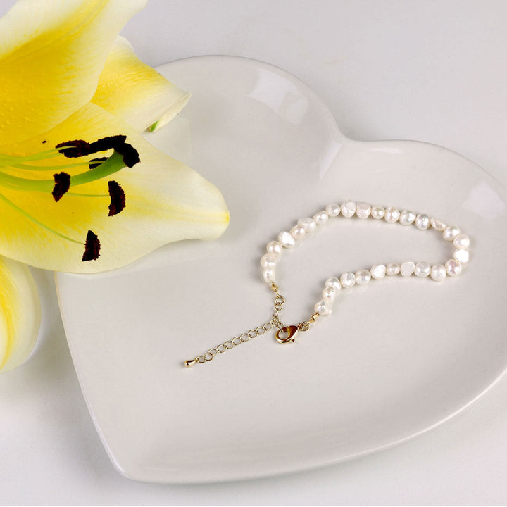 Bracelet de perles, doré à l'or fin en 18K